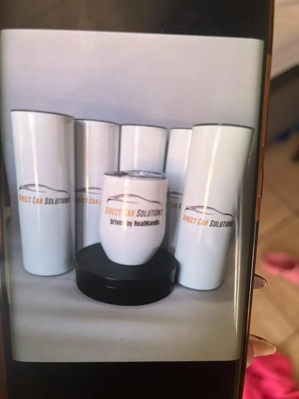Tall and short white tumblers with matching company branding